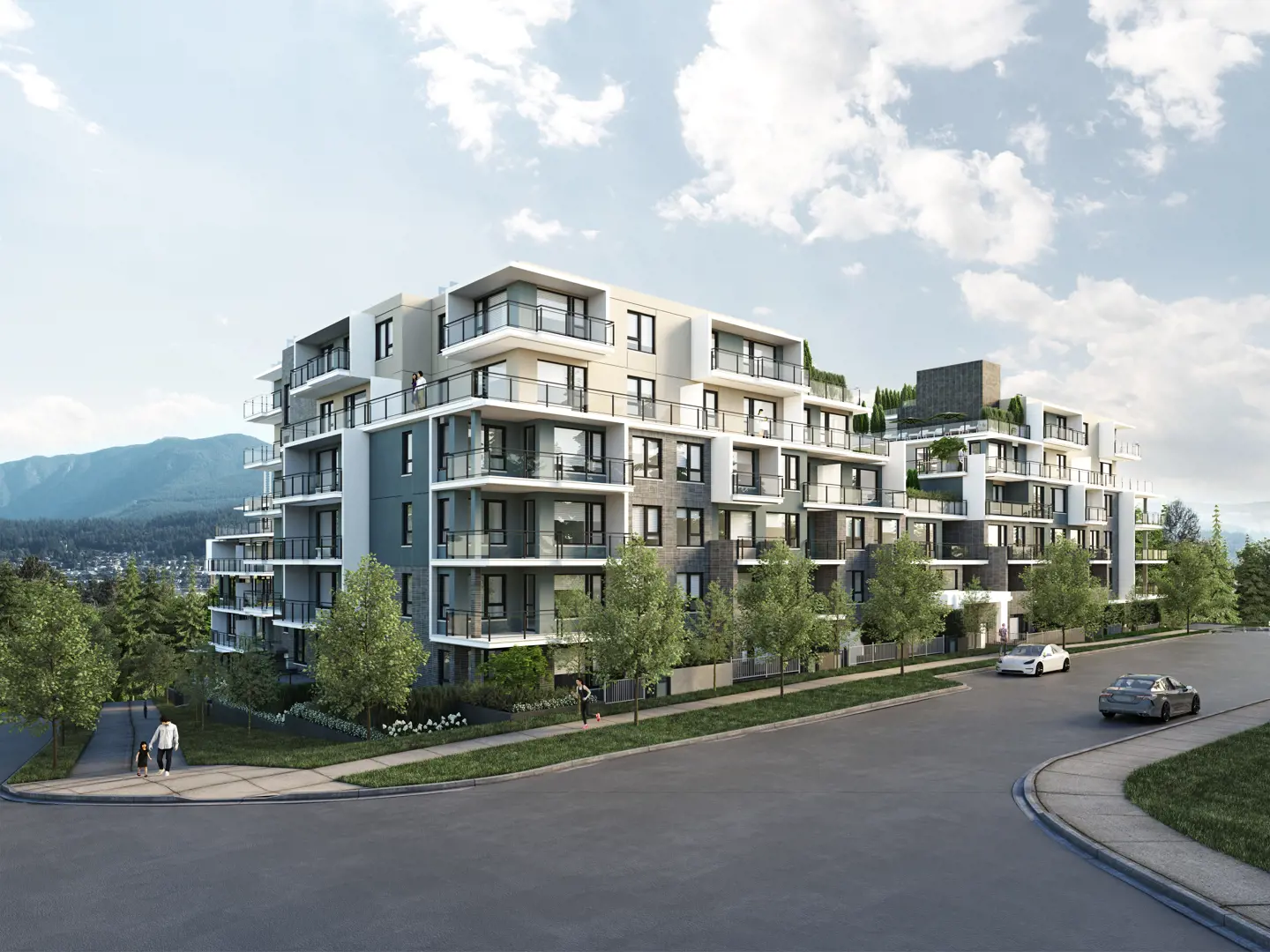 Modern multi-story residential building development showcasing Metro Standard Insulation's quality construction work with mountain backdrop